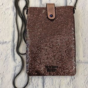 Victoria’s Secret small pink crossbody purse with metal chain strap. Zip closure
